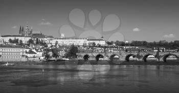 Panoramic view of Old Prague with St. Vitus Cathedral and Charles Bridge. Stylized black and white photo