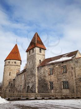Ancient stone fortress walls with towers and windows. Tallinn, Estonia