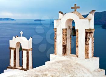 Santorini orthodoxy church with Mediterranean Sea on the background