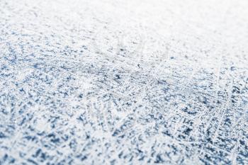 White frost pattern on dark ice, background photo with selective focus