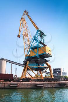 Huge port crane stands on pier in Burgas harbor, Black Sea coast, Bulgaria