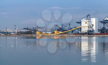 Bulk cranes and industrial buildings. Port of Burgas, Black Sea, Bulgaria
