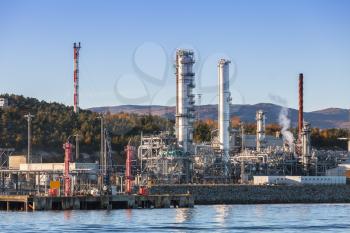 Norwegian oil plant, coastal industrial landscape with chimneys and buildings