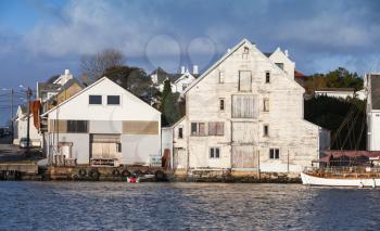 Coastal view of Haugesund city with white wooden barns, Rogaland county, Norway