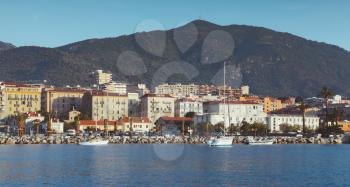 Port of Ajaccio, seaside view. Corsica, French island in the Mediterranean Sea. Summer cityscape with vintage tonal correction filter effect