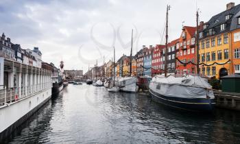 Nyhavn or New Harbour, it is a 17th-century waterfront, canal and popular touristic district in central Copenhagen, Denmark