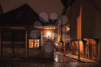 Traditional Norwegian wooden houses at night, Bergen Bryggen street view