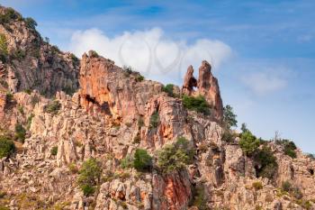 Rock with heart shaped hole. Calanques de Piana. Mountain landscape of Corsica island, France