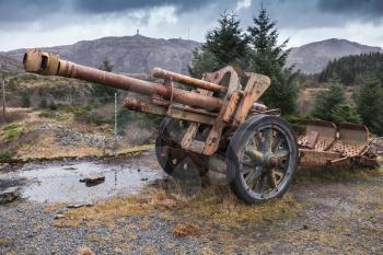 Old rusted German cannon from World War II period. Trondheim region, Norway