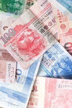 Hong Kong dollars, colorful banknotes close-up, vertical background photo
