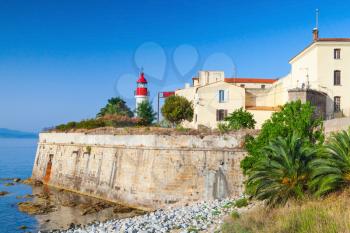 Coastal landscape of Ajaccio, old citadel with lighthouse tower, Corsica island, France