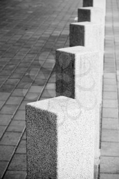 Abstract architecture composition, white square bollards in a row