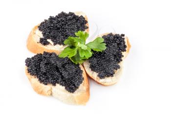 Small sandwiches with black caviar isolated on white background