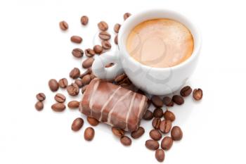 Small espresso cup with chocolate and coffee beans isolated on white