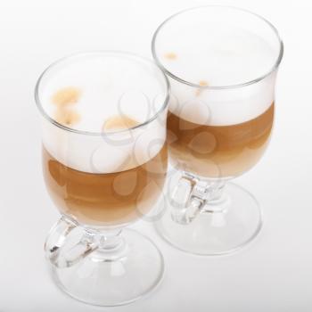 Two glasses with handles of latte coffee