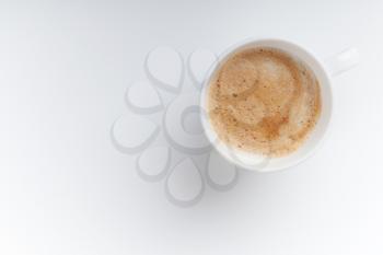 Small espresso cup. Top view on white table background