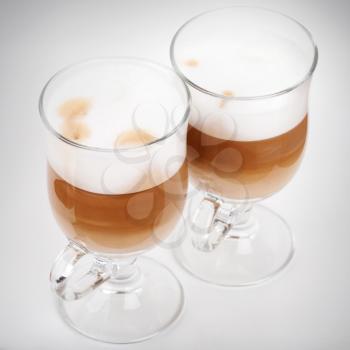Two glasses with handles of latte coffee