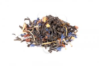 Small pile of big leaf black tea mixed with herbs and dry fruits. Calendula, sunflower, cornflower, rosehip berries. Selective focus with shallow DOF