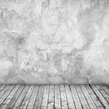 Abstract empty interior background with grungy concrete wall and wooden floor