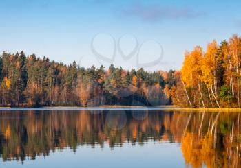 Lake colorful landscape in sunny autumn morning