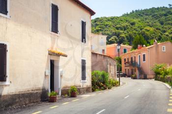 Empty street of Piana town in a summer day. Corsica island, France