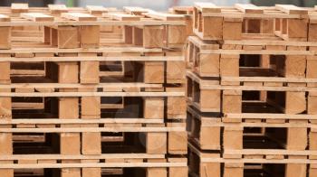 Pile of wooden pallets on a storage area