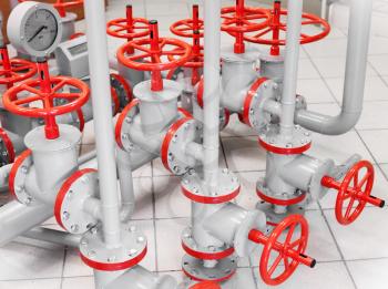 Group of red industrial valves on gray pipelines