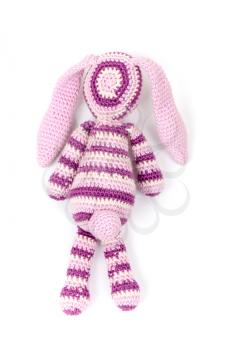 Knitted rabbit toy isolated on white with soft shadow, back view
