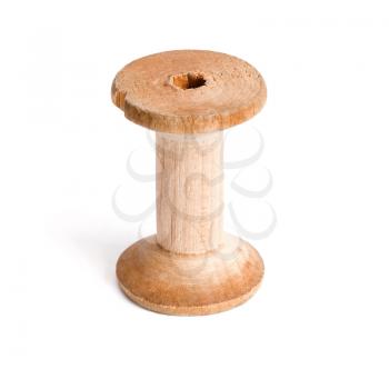 Old wooden empty reel of thread on white background