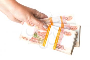 Stacks of  money. Russian rubles banknotes in female hand isolated on white background