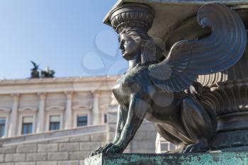 Statue of a sphinx. Decoration of old street lamp in front of Austrian Parliament Building, Vienna, Austria. It was erected in 1900. Selective focus