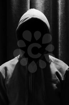 Portrait of Invisible man in the hood with curtain background