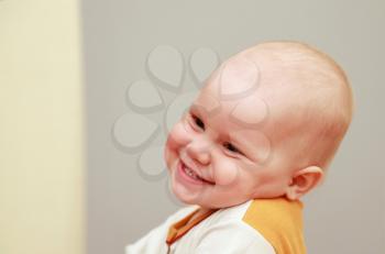 Closeup portrait of funny smiling Caucasian baby