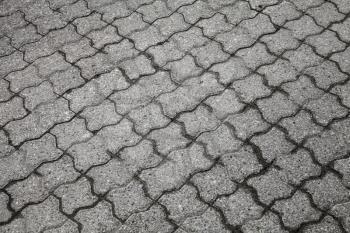 Background texture of gray urban cobblestone road