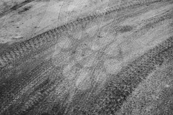 Abstract road background with tires tracks on asphalt