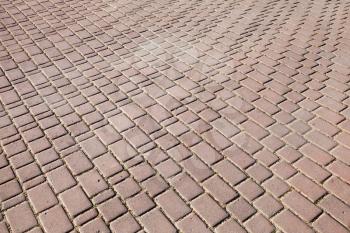 Background texture of modern red cobblestone pavement