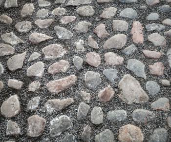 Background texture of old cobblestone road surface