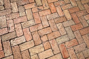 Old red cobblestone pavement, background photo texture