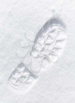 One man's footstep on the fresh friable snow