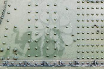 Abstract dark green industrial metal background texture with rivets