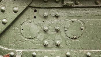 Abstract green industrial metal background texture with bolts and rivets