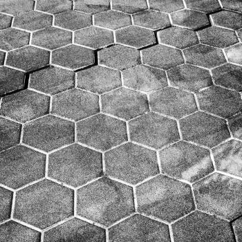 Dark gray honeycomb cobblestone pattern, street pavement background texture