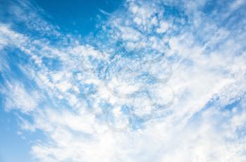 Blue sky with white altocumulus cloud layer, natural background photo texture