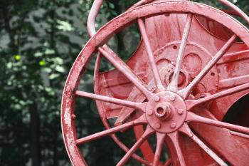 Red reel on vintage fire engine, closeup photo with selective focus