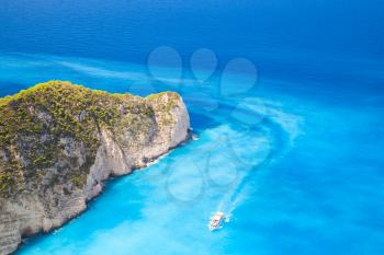 Touristic motor boat goes on Navagio Bay to the Ship Wreck beach. The most famous nature landmark of Greek island Zakynthos in the Ionian Sea