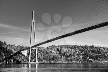 Black and white photo of Skarnsund Bridge, modern automotive cable-stayed bridge in Norway