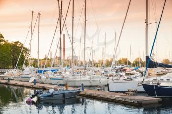 Sailing yachts and pleasure motorboats are moored in marina of Kotka, Finland