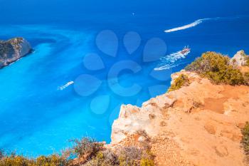Touristic pleasure boats in Navagio Bay, Ship Wreck beach. The most famous nature landmark of Greek island Zakynthos in the Ionian Sea