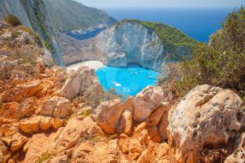 Navagio bay summer landscape with red coastal rocks. The most famous natural landmark of Zakynthos, Greek island in the Ionian Sea