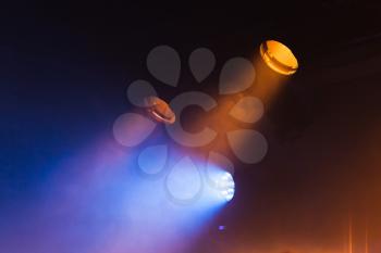 Colorful spot lights and scenic smoke, stage illumination background photo